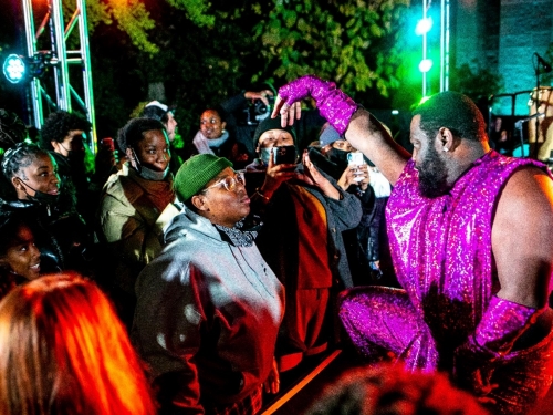 Outdoor event at night with crowd of people